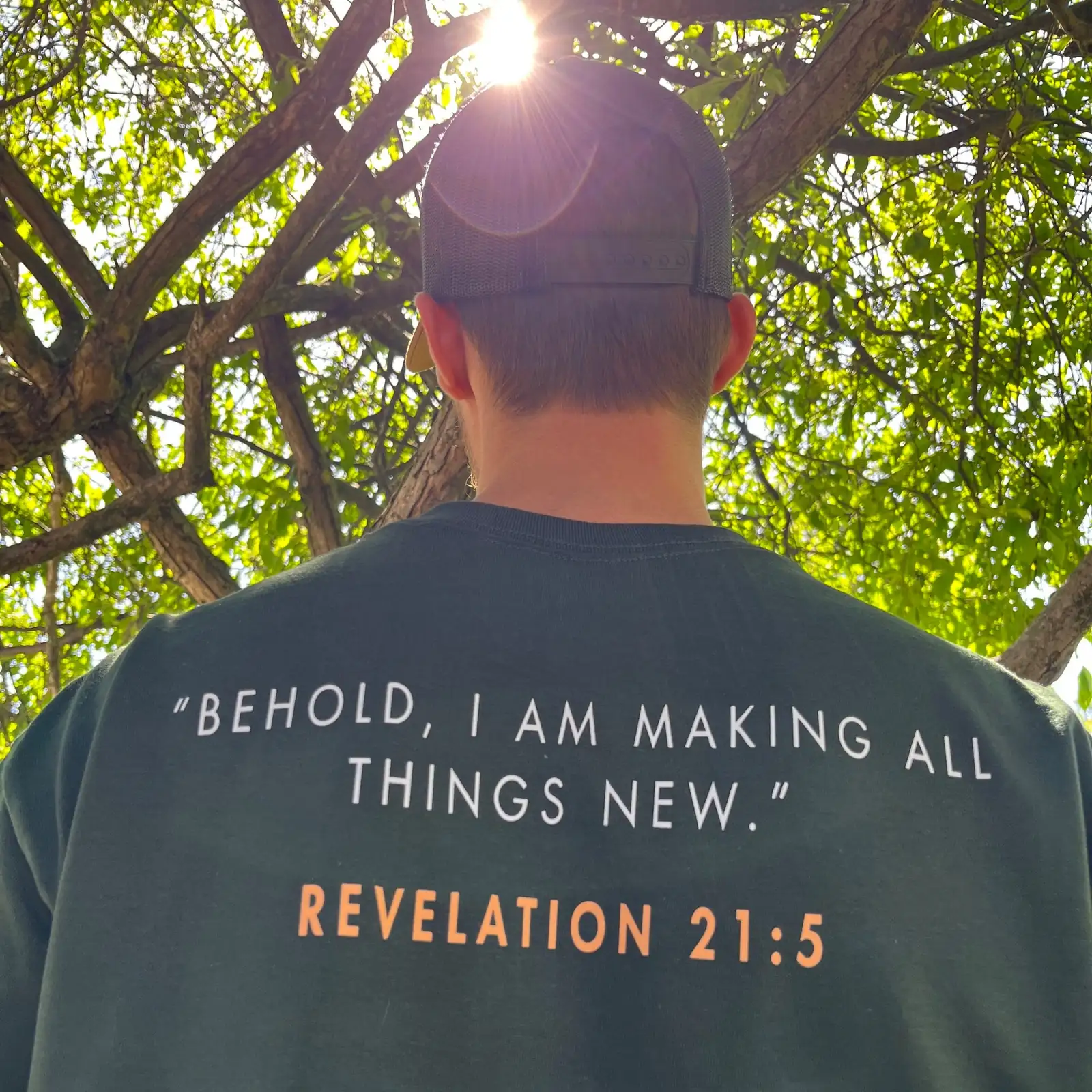 Genesis Cleaning Co. team member wearing the Making All Things New shirt